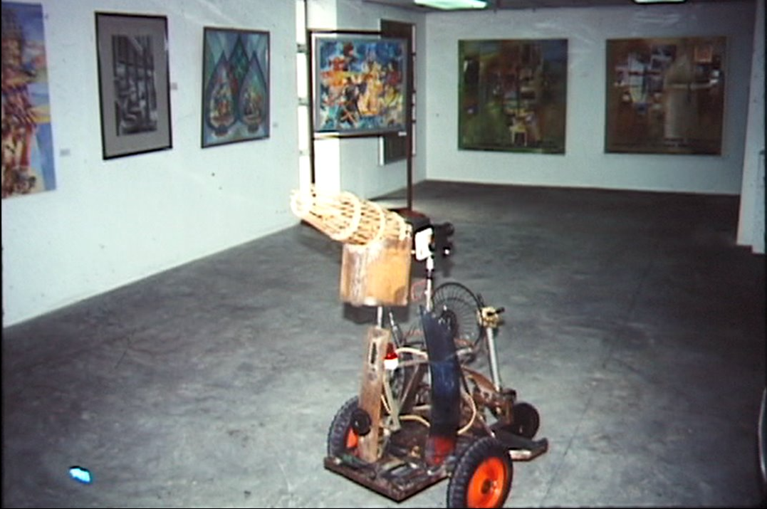 Baharudin Mohd Arus. The Medium is the Message (After Marshall McLuhan). 1989. Collection of the artist. <br> Image courtesy of Ray Langenbach Ⓒ Baharudin Arus. Part of Baharudin Moh Arus’s art installation, The Medium is the Message (After Marshall McLuhan), featuring a lawnmower carrying a video camera.